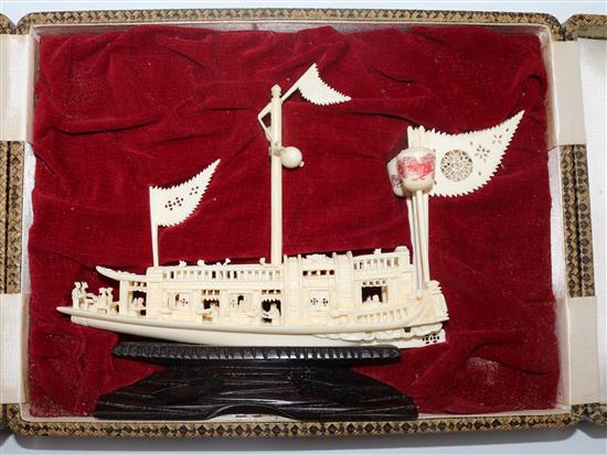 A Chinese ivory model of a boat, cased